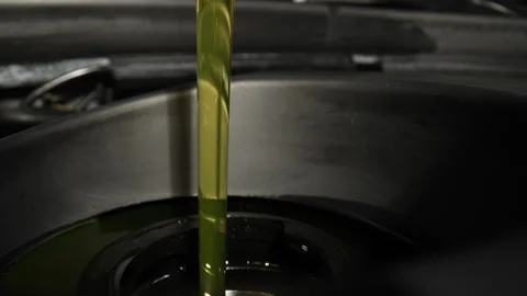 Pouring Engine Oil into the car Stock Footage 250008896