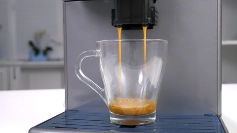 Pouring espresso from coffee machine Stock Footage 114576692