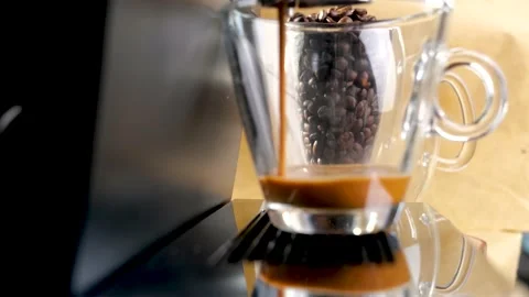Pouring espresso coffee stream from professional machine in cup Stock Footage 148326326