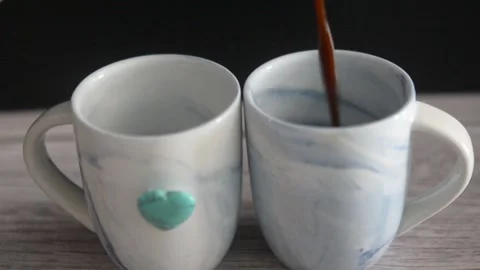 Pouring Espresso into Two Coffee Cups Close-Up Stock Footage 327982327