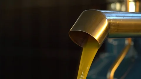 Pouring Extra Virgin Olive Oil Into Tank Stockbeeldmateriaal 105835014