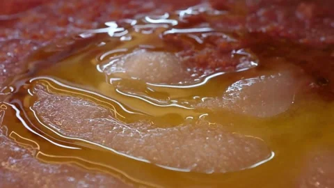 Pouring Extra Virgin Olive Oil on Freshly Baked Italian Pizza Crust - Macro Slow Stock Footage 337676570