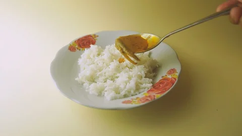 Pouring fish curry on the rice Stock Footage 104128224