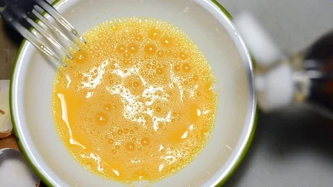 Pouring fish sauce into egg Stock Footage 72386646
