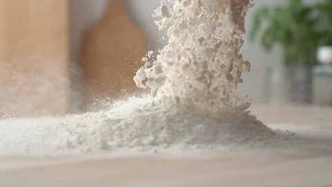 Pouring flour onto a cooking table. Slow Motion. Stock Footage 121492693