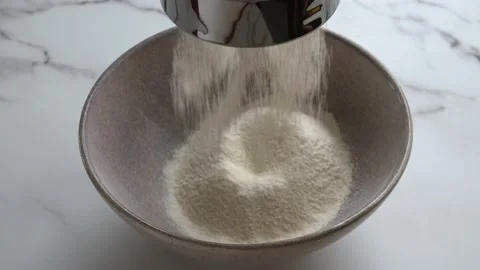 Pouring flour Stockbeeldmateriaal 234439360