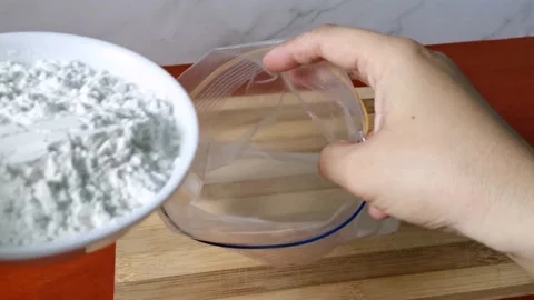 Pouring Flour Inside a Zip Lock Bag Stock Footage 161006068