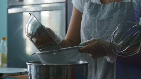 Pouring the flour in a sieve Stock Footage 75541731
