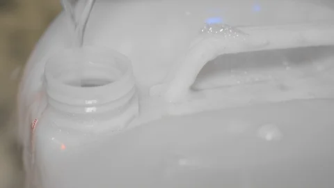 Pouring Fluid Into Canister Stock Footage 111067357