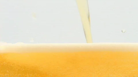 Pouring fresh beer into glass Stock Footage