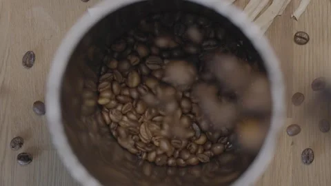 Pouring Fresh Coffee Beans into a Container Video stock 286223110