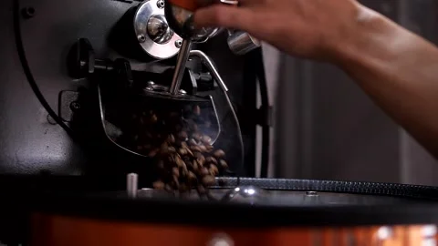 Pouring Fresh Coffee Beans Roasted inside Machine in Super Slow Motion Stock Footage 266523722
