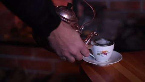 Pouring Fresh Coffee by the Fireplace 스톡 동영상 308906397