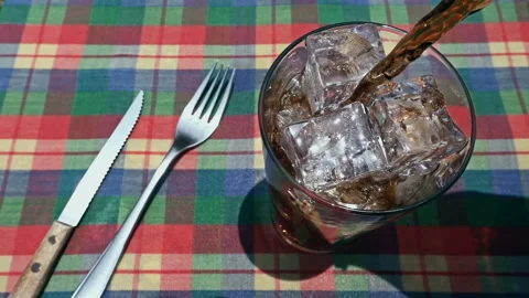 Pouring Fresh Cold Black Beer from Bottle into Glass on Table Stock Footage 342970167