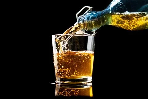 Pouring fresh gold apple cider Stock Photos