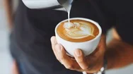 Pouring Fresh Latte Of Warm Coffee For A Morning Breakfast Drink Stock Footage