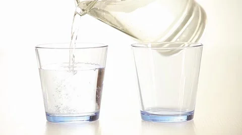 Pouring fresh water into the glasses  Video stock 8564132
