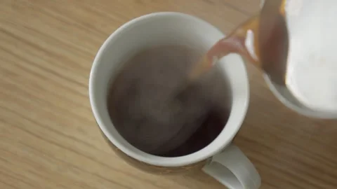 Pouring Freshly Brewed Coffee into a White Mug Stock Footage 292873609
