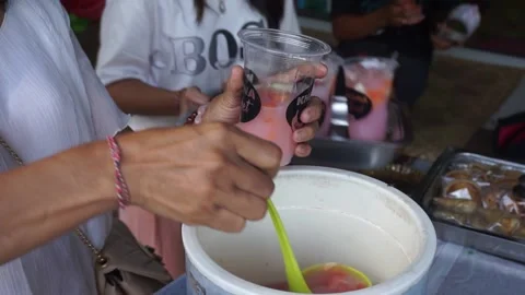 Pouring fruit ice into a glass, a typical Indonesian drink 動画素材 198677758