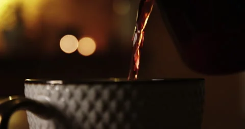 Pouring Fruit Tea Into a Cup. Pan Shot in Slow Motion. Stock Footage 262004323