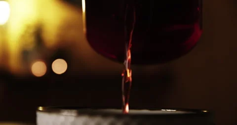 Pouring Fruit Tea into Cup. Tilt Down Shot in Slow Motion Stock Footage 262005512
