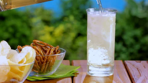 Pouring ginger ale into glass Stock Footage 24673797