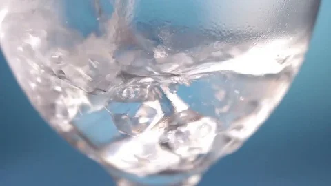 Pouring into the glass with ice cubes Stock Footage 116095547