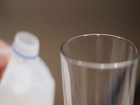 Pouring a glass of milk Stock Footage 80739533