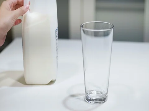 Pouring a glass of milk Stock Footage 80739742