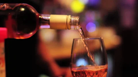 Pouring a Glass of Red /Rose Wine at Bar - Close Up HD Stock Footage