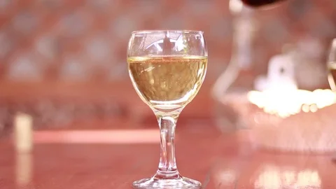Pouring a glass with white wine 動画素材 80550049
