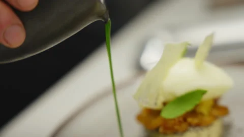 Pouring green sauce. Stock Footage 182848566