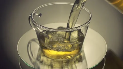 Pouring green tea into cup Stock Footage 55876678