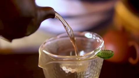 Pouring green tea Oolong in a cup. Healthy chinese tea. Stock Footage 140714525