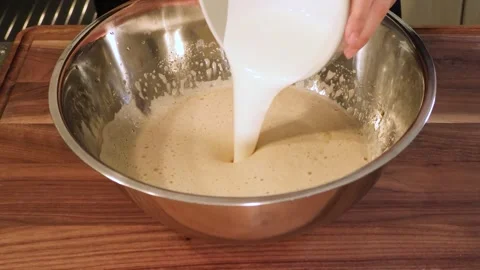 Pouring Heavy Cream into Cake Batter - Horizontal Stock Footage 331023716