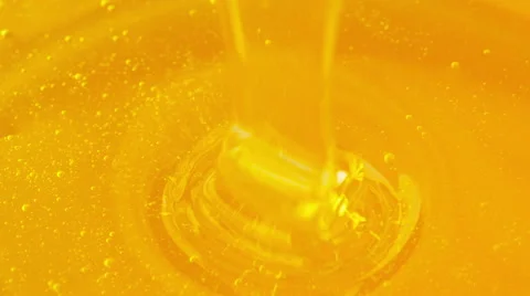 Pouring honey. Close-up Stock Footage 67572319