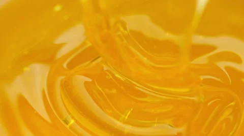 Pouring honey. Close-up Vídeos de archivo 67941762