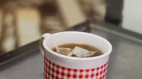 Pouring Honey On A Cup Of Tea Video stock 85077613