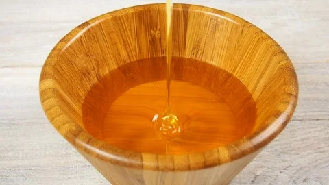 Pouring Honey Stock Footage 77224203
