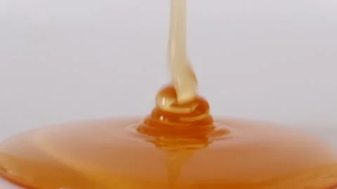 Pouring honey Stock Footage 220773054