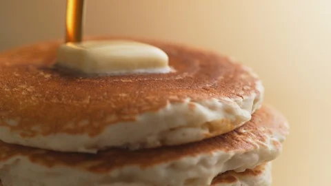 Pouring honey on stack of pancakes. Slow Motion. Stock Footage 87242084