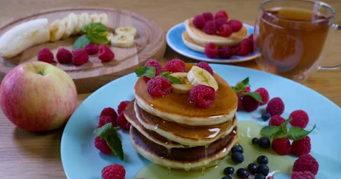 Pouring honey on stack of pancakes.. Tasty breakfast food Stock Footage 159008076