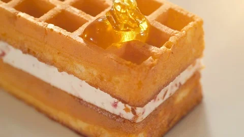 Pouring honey on waffles Stock Footage 72827869