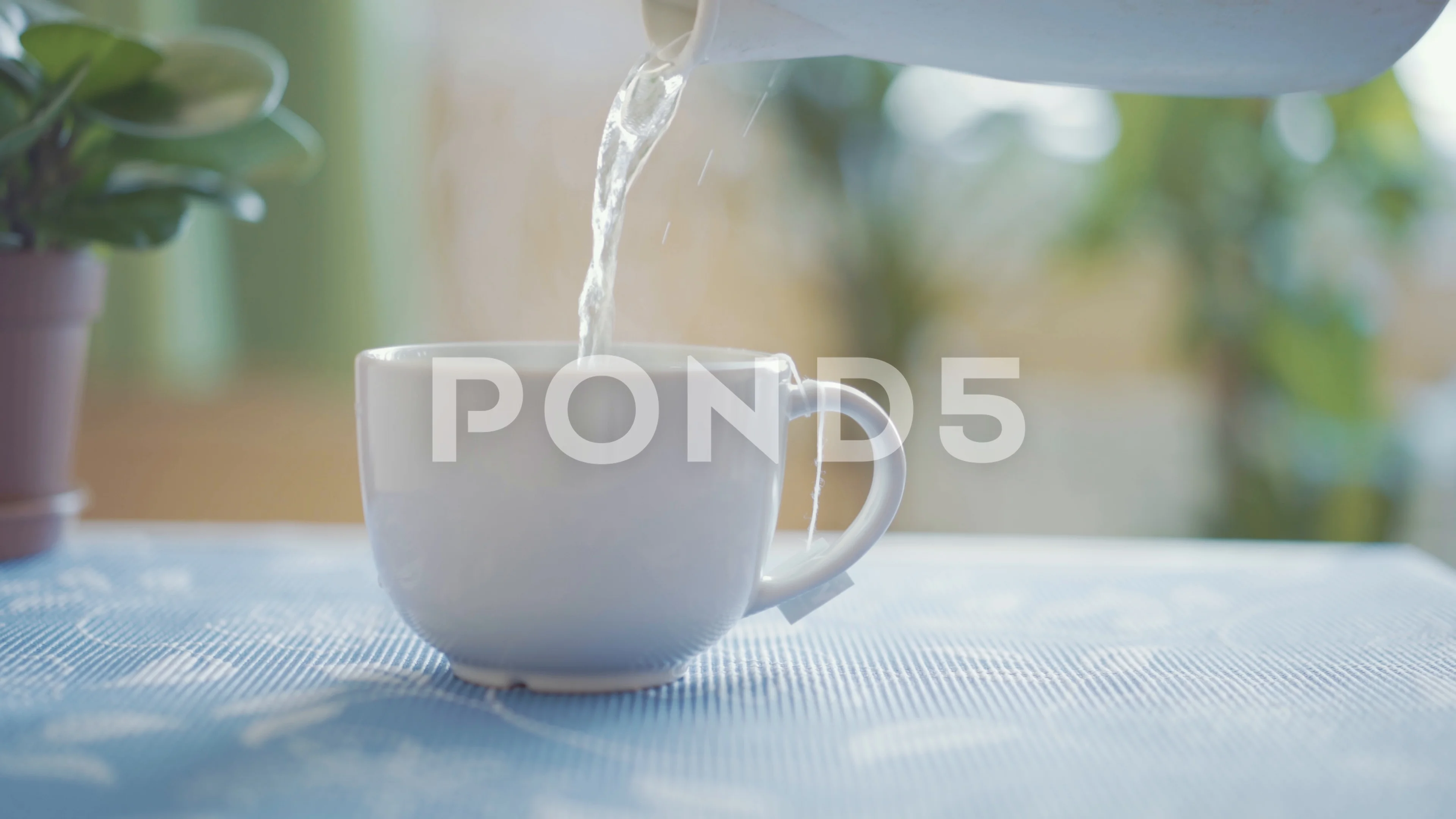 https://images.pond5.com/pouring-hot-boiling-water-cup-footage-103085171_prevstill.jpeg