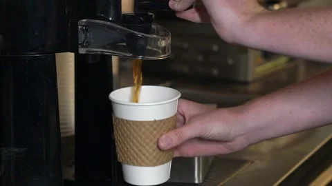 Pouring hot coffee from coffee machine Stock Footage 139844848