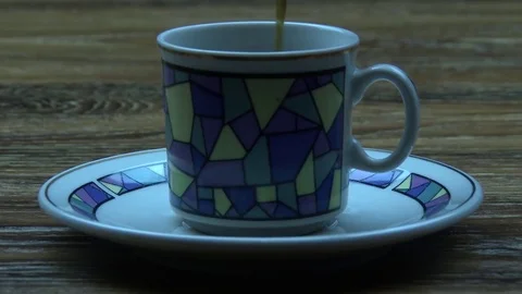 Pouring hot coffee into a cup 스톡 동영상 79993024