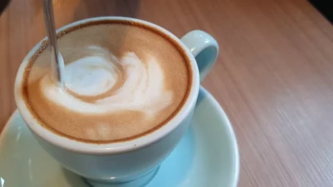 Pouring hot coffee in cup  Stock Footage 141800640
