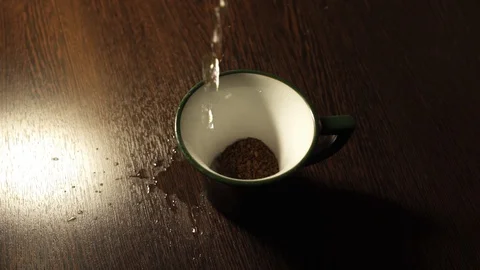 Pouring hot coffee in a mug in a bad mood Stock Footage 117734003
