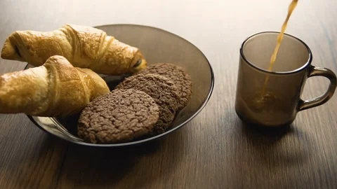 Pouring Hot Coffee near Tasty Pastry Stock Footage