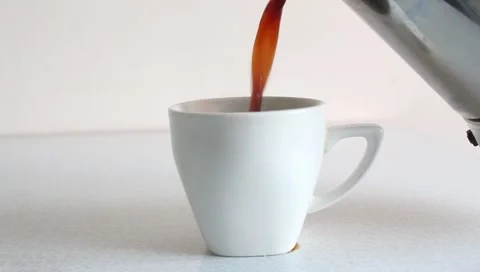 Pouring Hot Coffee into White Cup Video. Stock Footage 345562306
